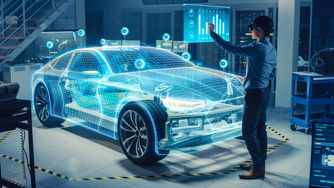Automotive engineer using virtual reality headset for analyzing virtual electric car 3D model